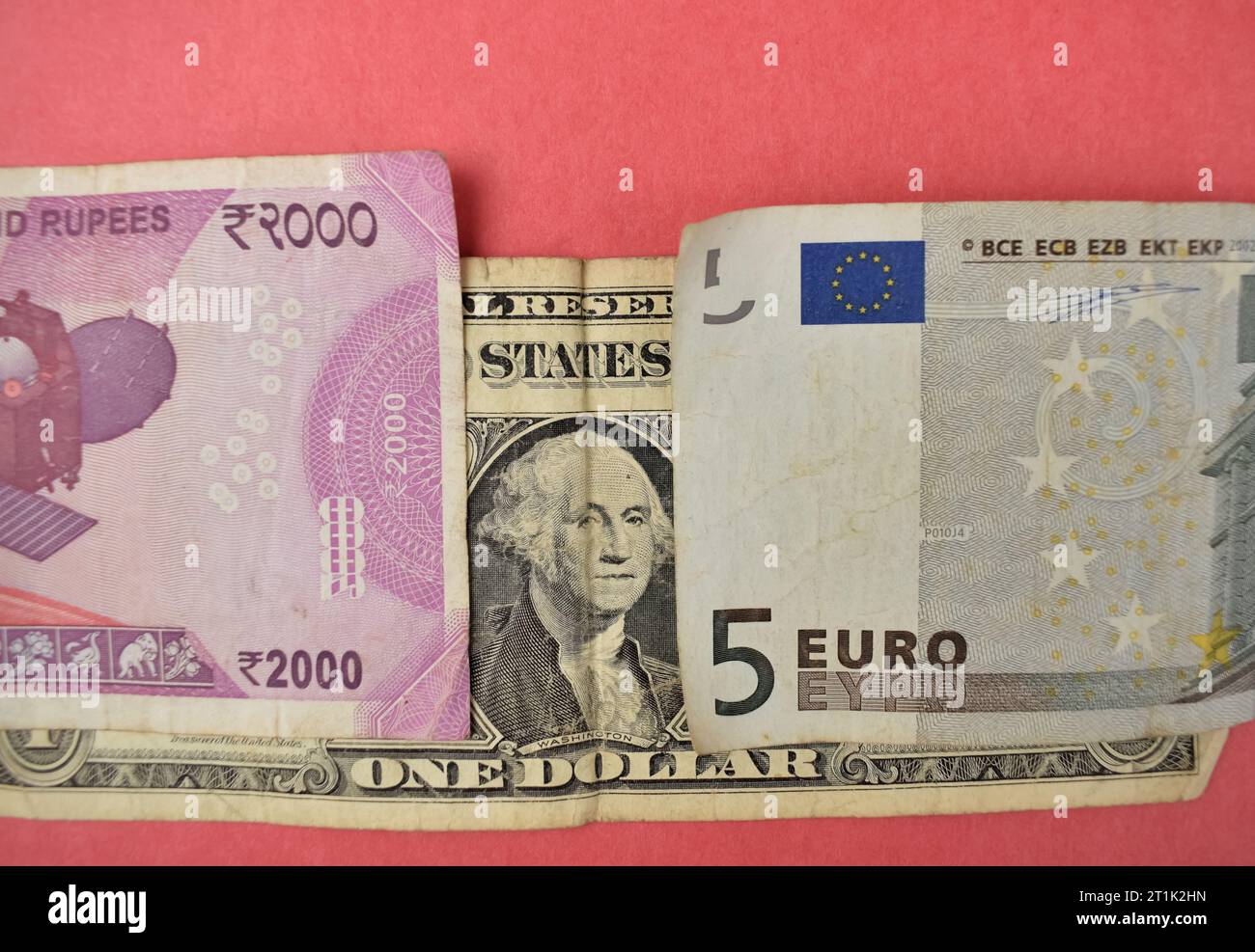 A closeup pictute of a US Dollor covered by EURO and Indian currency note, signifying the emergence of alternate currency to Dollor Stock Photo