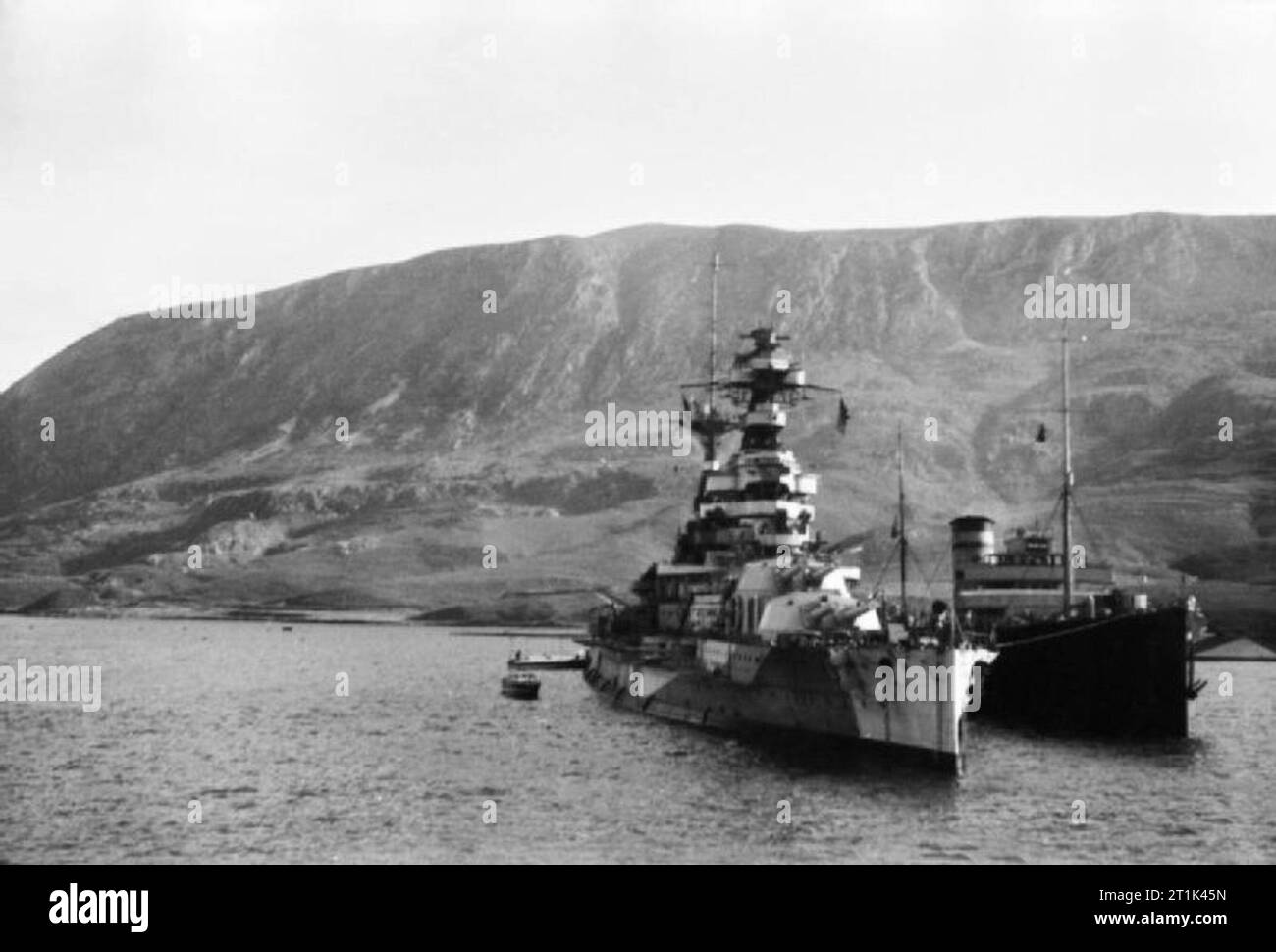 The Royal Navy during the Second World War HMS BARHAM oiling in Suda Bay, Greece. Stock Photo