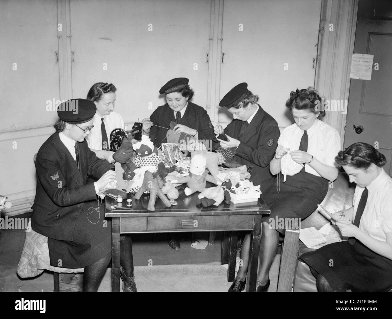 The Women's Royal Naval Service during the Second World War A group of Wrens, in Liverpool, make toys from scraps of old clothing as Christmas gifts to the children of local sailors. Stock Photo