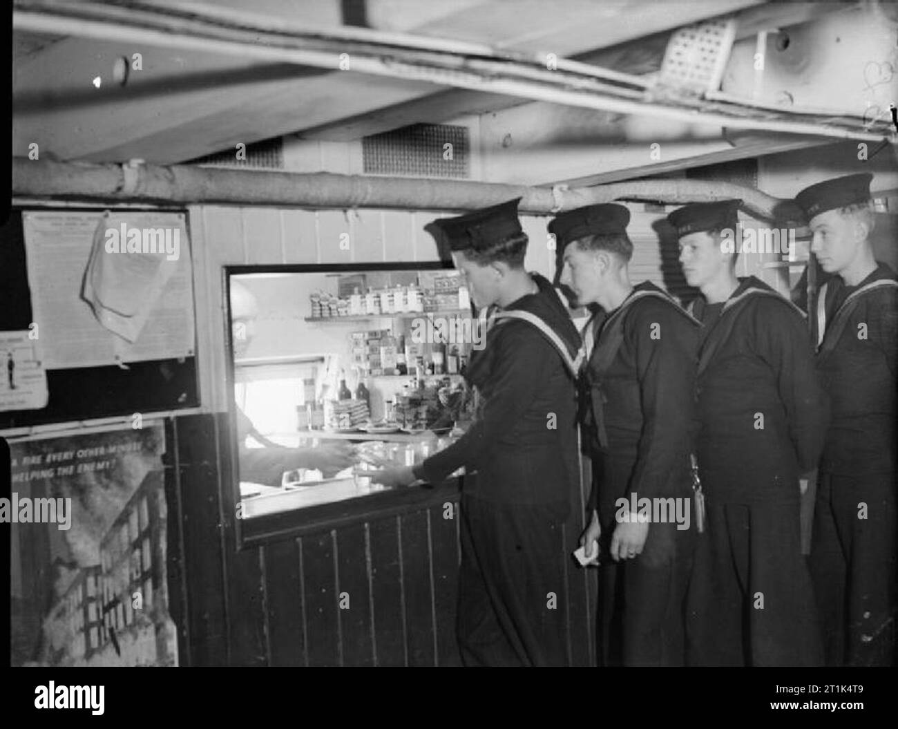 Training in the Royal Navy, Aboard HMS Implacable, Portsmouth, 6 October 1944 Lining up for 'Nutty' (sweets, chocolate etc) at the well stocked NAAFI canteen on board the IMPLACABLE. Stock Photo