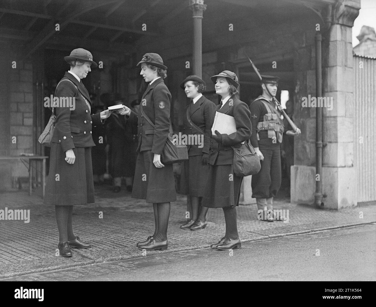 Wrns at Work. 1940, at a Royal Navy Barracks. Regulating Wren at