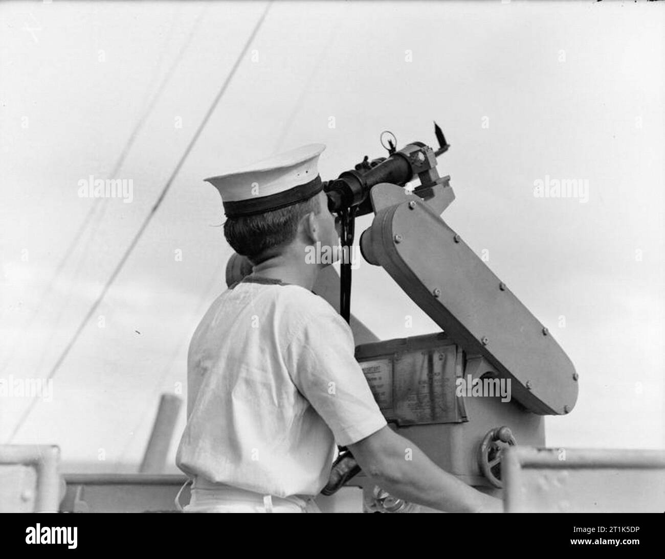 HMS Mauritius. July 1942. A lookout watching the skies through