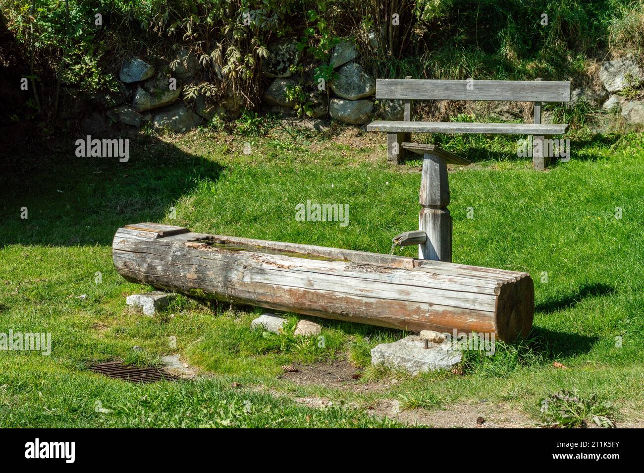 Traditional Wooden water trough, water well with trough in European