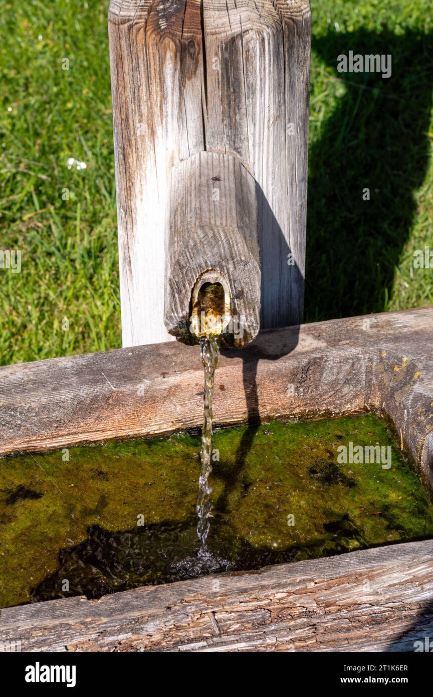 Traditional Wooden water trough, water well with trough in European