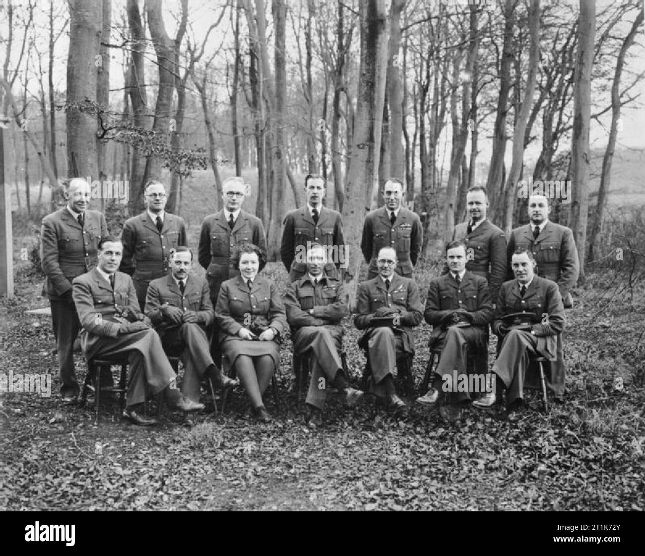 Photography during the Second World War A group of Bomber Command Photographic Officers, led by Group Captain F C Sturgiss OBE. Standing left to right: Squadron Leader E King, Squadron Leader J E Brown, Squadron Leader J Jameson, Flight Lieutenant J S Cabot, Squadron Leader L Mant, Squadron Leader A S Archer (from Canada), Pilot Officer R G Cleave. Sitting left to right: Squadron Leader H W Lees, Squadron Leader L Hardy, Station Officer T Hamilton-Jones, Group Captain F C Sturgiss, Squadron Leader F L Wills, Flight Lieutenant J J McCloskey, Squadron Leader J E Archibald. Stock Photo