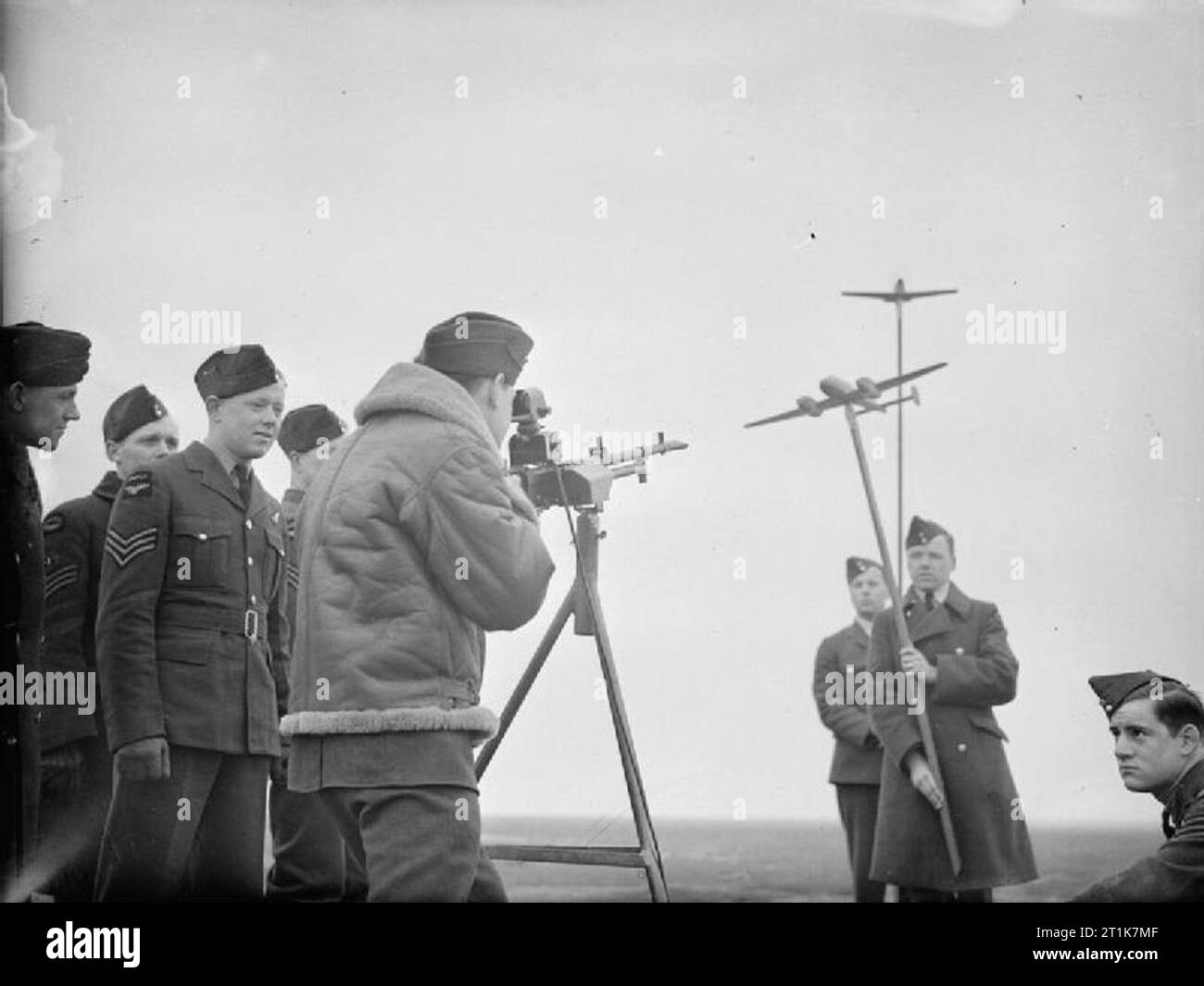 Royal Air Force Army C-operation Command, 1940-1943. Air gunners of No. 400 Squadron RCAF being trained in aircraft recognition and judging the distances of enemy aircraft by means of scale models, at Odiham, Hampshire. Stock Photo