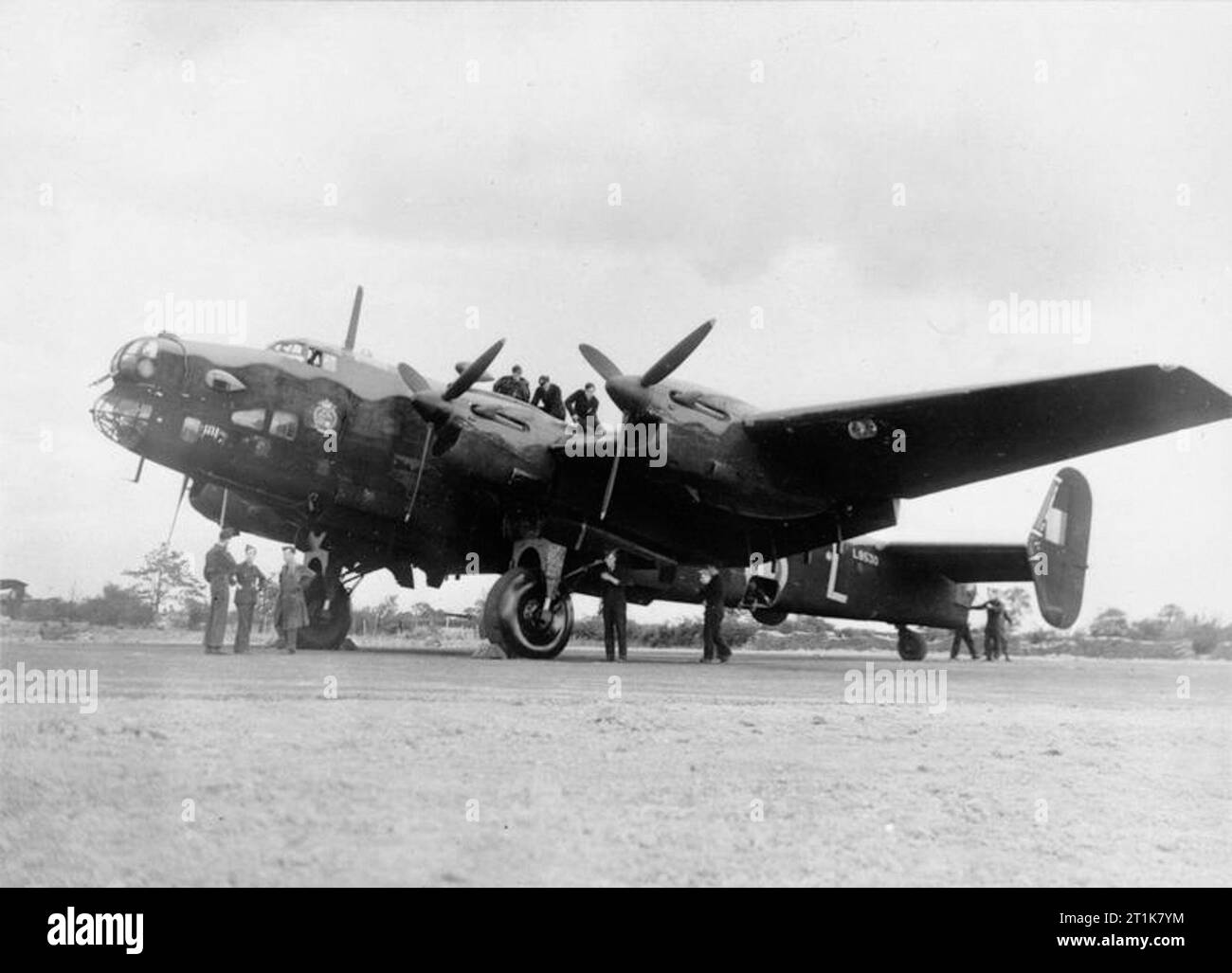 Royal Air Force Bomber Command, 1939-1941. Handley Page Halifax Mark I Series 1, L9530 &#145;MP-L&#146;, of No 76 Squadron RAF undergoing maintenance at Middleton St George, County Durham. L9530 was shot down while attacking Magdeburg on 15 August 1941. Stock Photo