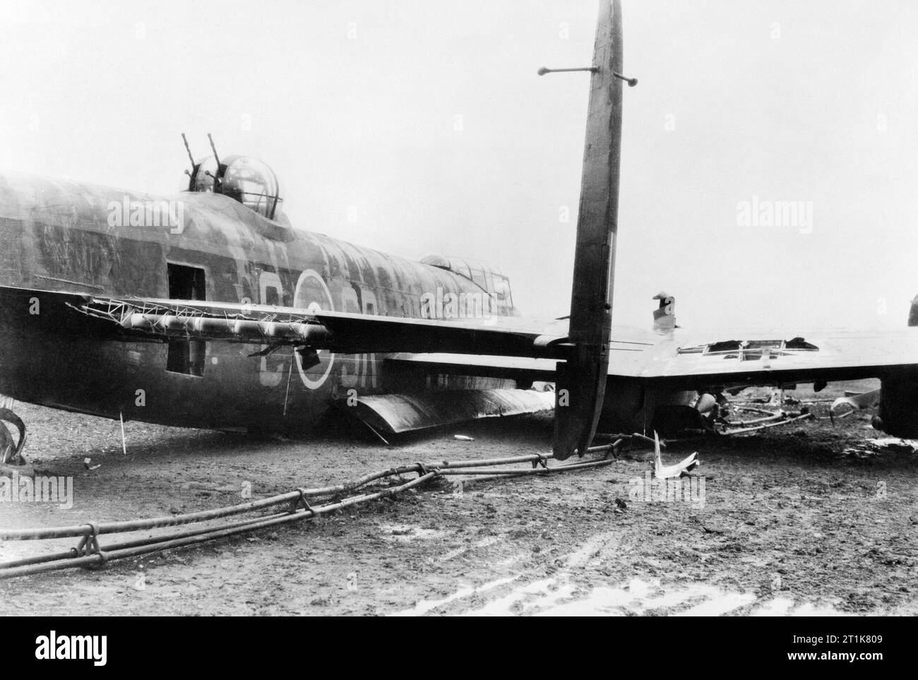 Air Ministry Second World War Official Collection. Damaged Avro Lancaster of No. 101 Squadron RAF (identified by squadron code SR on fuselage) at Ludford Magna, Lincolnshire, after a successful crash-landing on returning from a raid to Augsburg on the night of 25/26 February 1944. Stock Photo