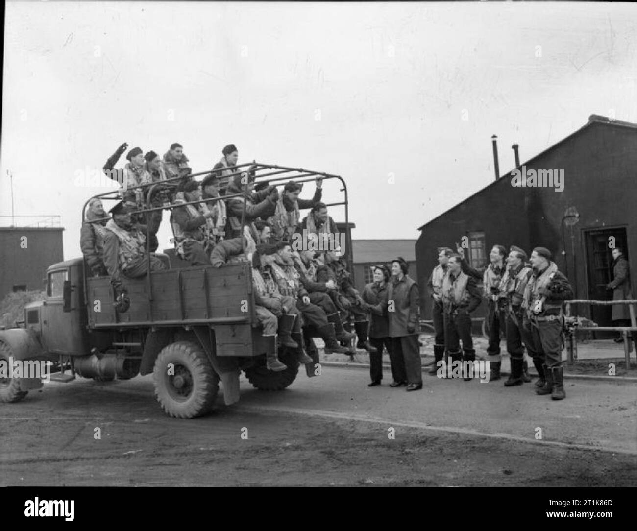 Royal Air Force Bomber Command, 1942-1945. Crews of No. 77 Squadron RAF about to be driven to the dispersals at Elvington, Yorkshire, for the Squadron's fourth raid on Berlin, Germany. Note the two WAAF drivers by the tailboard of the lorry. Stock Photo