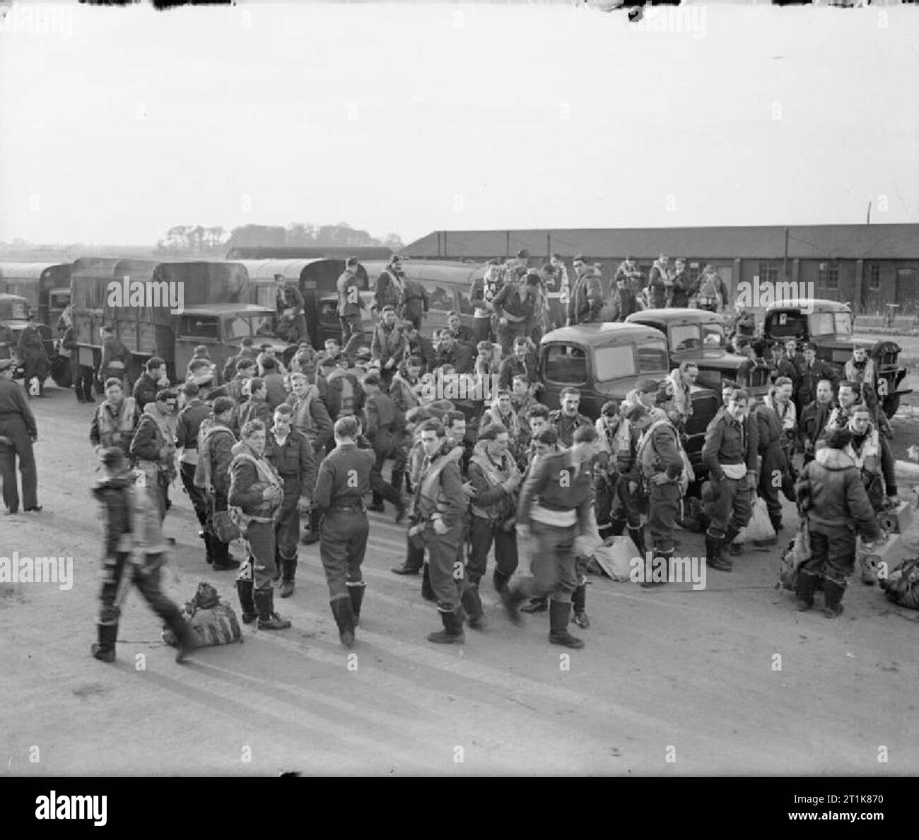 Royal Air Force Bomber Command, 1942-1945. Following their briefing, Handley Page Halifax crews of No. 76 Squadron RAF board their transports at Holme-on-Spalding-Moor, Yorkshire, to be driven to their dispersals in preparation for a raid on Kassel, Germany. This raid, on 22/23 October 1943, was the most devastating delivered on a German city since the 'firestorm' raid on Hamburg in the previous July. Of the 569 aircraft used in the attack, 43 were lost, of which 25 were Halifaxes. Stock Photo