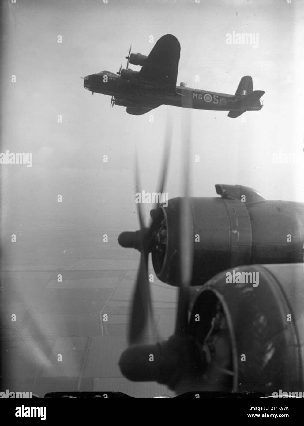 Royal Air Force Bomber Command, 1942-1945. Short Stirling Mark I, N3706 'MG-S', of No, 7 Squadron RAF based at Oakington, Cambridgeshire, in flight above the starboard wing of another aircraft of the Squadron. Stock Photo