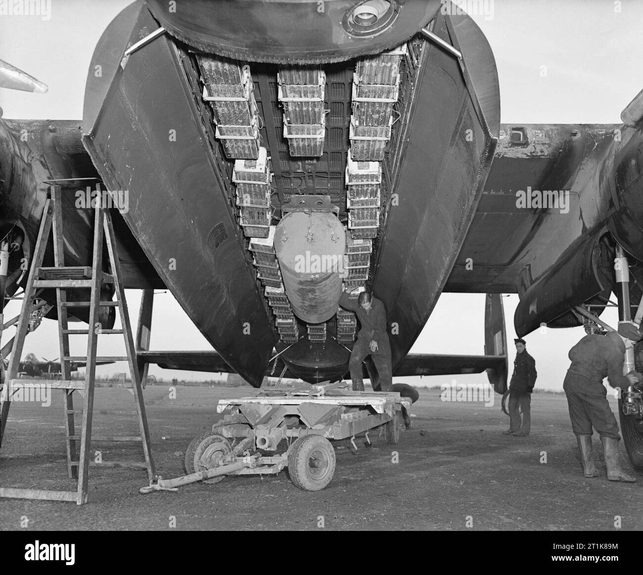 Royal Air Force Bomber Command, 1942-1945. The bomb load most commonly used for area bombing raids (Bomber Command executive codeword 'Usual') in the bomb bay of an Avro Lancaster of No. 57 Squadron RAF at Scampton Lincolnshire. 'Usual' consisted of a 4,000 impact-fused HC bomb ('cookie'), and 12 Small Bomb Containers (SBCs) each loaded with incendiaries, in this case, 236 x 4-lb incendiary sticks. Stock Photo