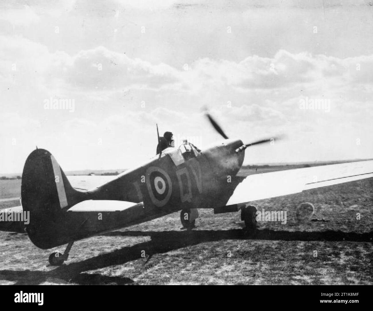 Air Ministry Second World War Official Collection. Supermarine Spitfire of No. 19 Squadron RAF (identified by squadron code QV). Appears to be a Mk I, possibly at RAF Fowlmere. Stock Photo