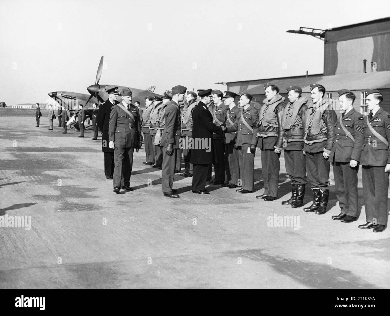 Royal Air Force Fighter Command, 1939-1945 King George VI meets the pilots of No. 111 Squadron RAF, accompanied by the Squadron Commander, Squadron Leader H Broadhurst, at Drem, East Lothian. The squadron moved later that day to Wick. Stock Photo