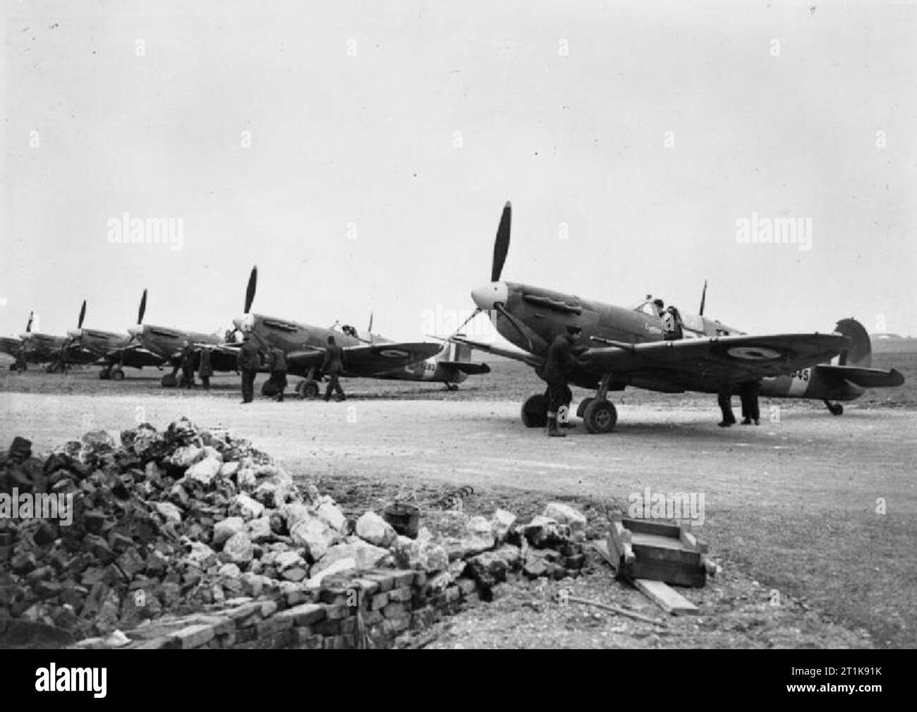 Royal Air Force Fighter Command, 1939-1945. Supermarine Spitfire Mark VBs of No. 72 Squadron RAF, lined up and ready to start at Gravesend, Kent. The nearest aircraft, AA945 'RN-C' 'Cynthia', subsequently served with a number of units up to July 1945; including Nos. 133, 306, 350, 504, 129, 501 and 345 Squadrons RAF, and finally with No. 61 Operational Training Unit. Stock Photo