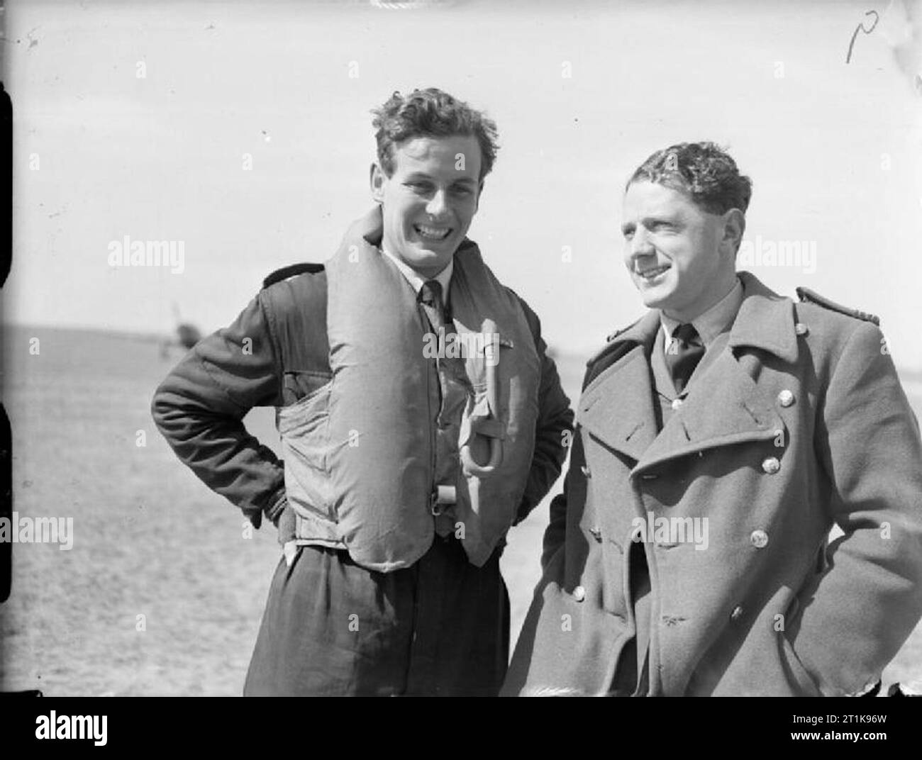 Royal Air Force Fighter Command, 1939-1945. Flight Lieutenants P W Townsend (left) and C B Hull of No. 43 Squadron RAF at Wick, Caithness, at the time they had shot down three enemy aircraft each. Hull became the commanding officer of the Squadron in September 1940 and was killed in action on 7 September having shot down at least 10 enemy aircraft. Townsend was to end his flying service with at least 11 victories, having commanded Nos. 85 and 605 Squadrons RAF. He then commanded RAF stations at Drem and West Malling, and No. 23 Initial Training Wing, before becoming Equerry of Honour to the Ki Stock Photo