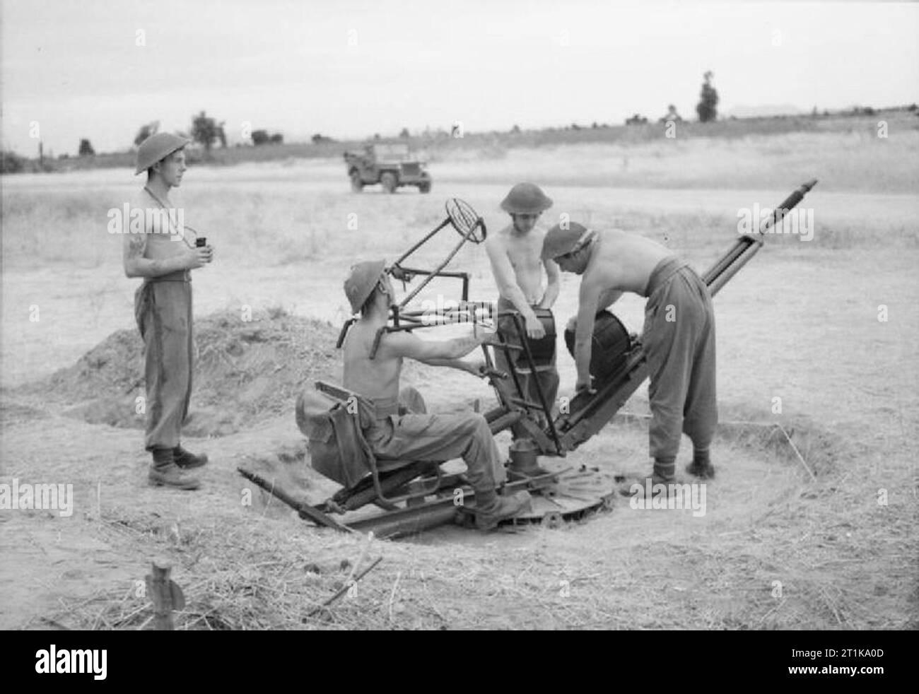 Royal Air Force Operations in the Far East, 1941-1945. An anti-aircraft gun team of the RAF Regiment man their 20mm Hispano Light AA cannon during gun drill on a forward airstrip in Burma. They are, (left to right), Corporal W Corcoran of London, and Leading Aircraftmen G A Shale of Reading, K Madrall of Liverpool and G Edgar of Ormskirk, Lancashire. Stock Photo