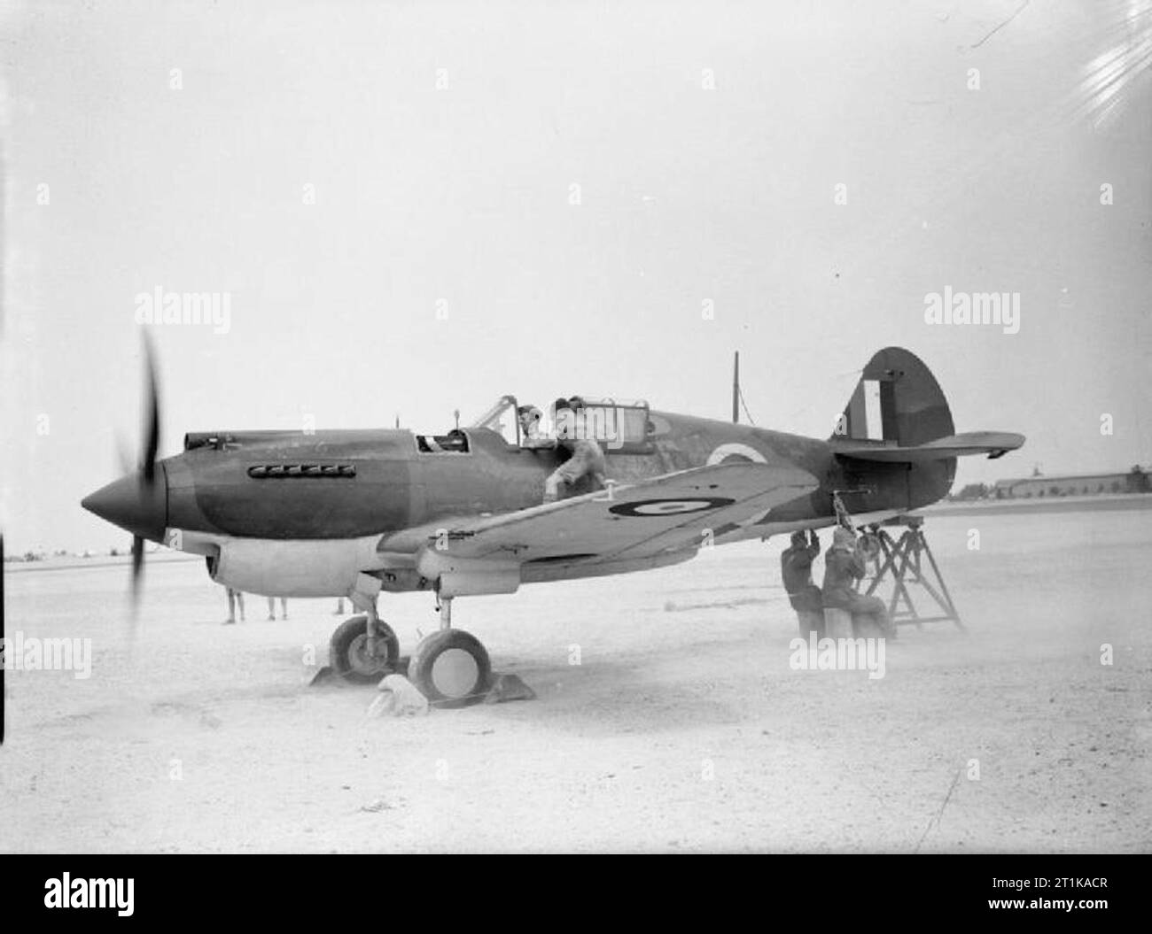 Royal Air Force Operations in the Middle East and North Africa, 1939-1943. Fitters testing the Allison V-1710-33 engine of Curtiss Tomahawk Mark IIB, AK326, at No. 107 Maintenance Unit, Kasfareet, Egypt. Stock Photo