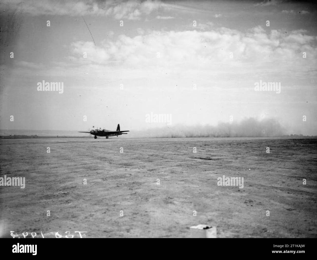 Royal Air Force Operations in the Middle East and North Africa, 1939-1943. A Vickers Wellington B Mark III of No. 330 Wing RAF, raises the dust as it takes off from Blida, Algeria, for a night bombing raid over Tunisia. Stock Photo