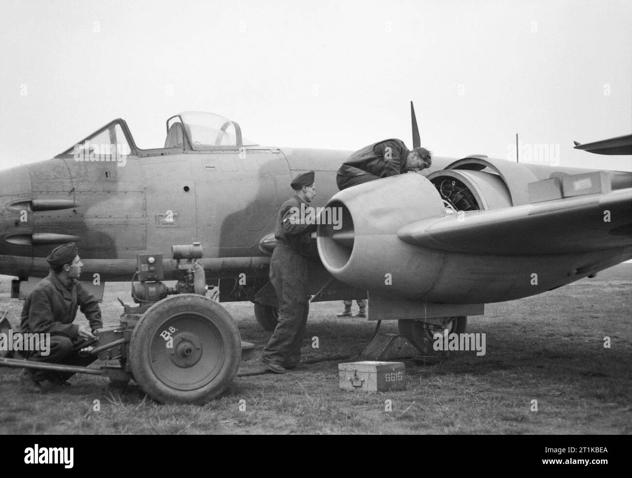 Royal Air Force- 2nd Tactical Air Force, 1943-1945. Engine fitters at work on the Rolls-Royce Derwent jet-engine of a Gloster Meteor F Mark III of No. 616 Squadron RAF at B156/Luneberg, Germany. Stock Photo