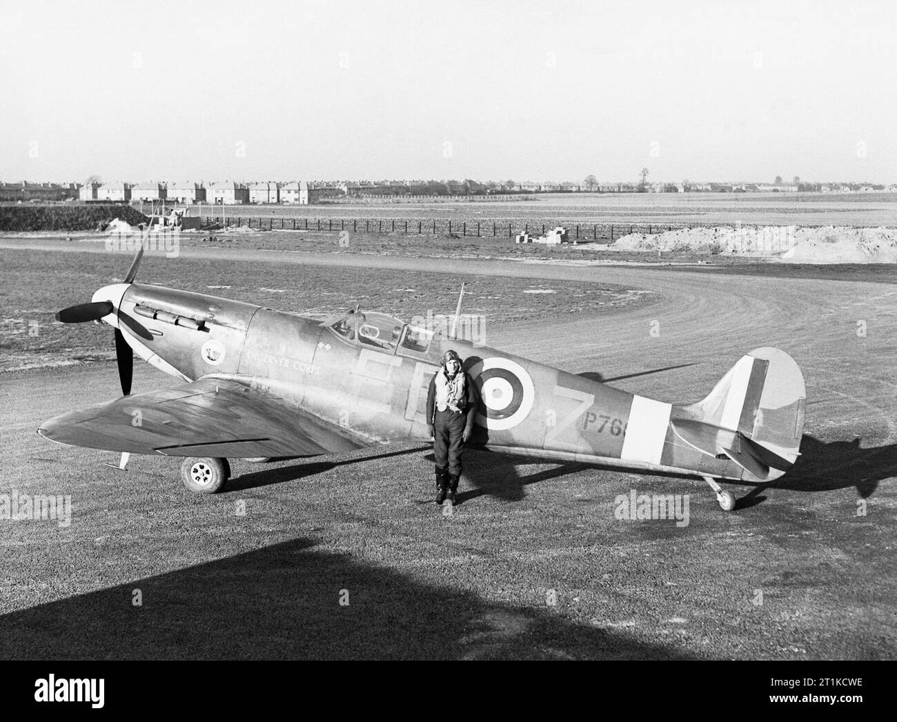 Squadron Leader Donald 'Don' Finlay, the CO of No. 41 Squadron RAF with his Supermarine Spitfire Mk IIA at Hornchurch, Essex, January 1941. Squadron Leader D O Finlay, the Commanding Officer of No. 41 Squadron RAF and former British Olympic hurdler, standing by his Supermarine Spitfire Mark IIA, P7666 &#145;EB-Z&#146; &#147;Observer Corps&#148;, at Hornchurch, Essex. Stock Photo