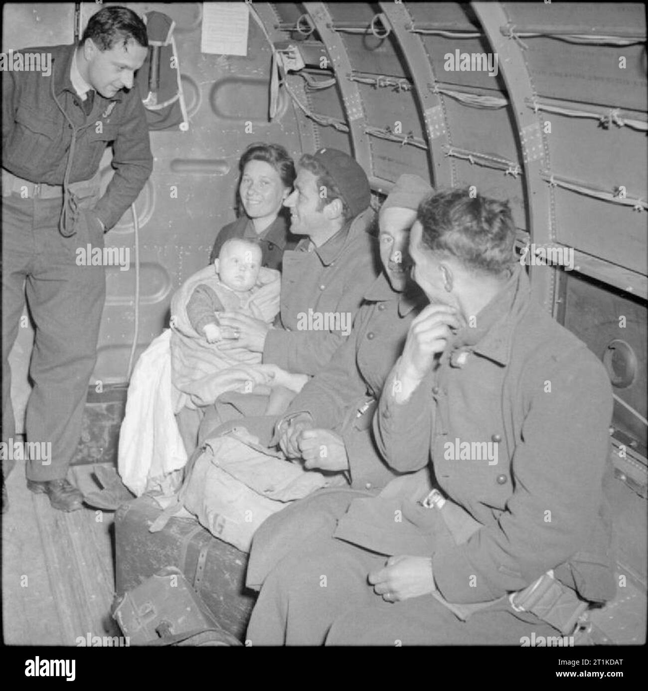 The Campaign in North-west Europe 1944-45 Belgian former POWs and displaced persons, including a family with a baby, on board an RAF Dakota aircraft prior to taking off from Rheine aerodrome en route to Brussels, 15 April 1945. Stock Photo