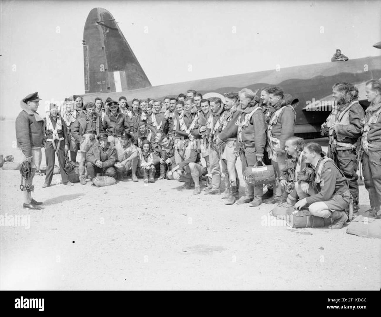 Royal Air Force Operations in the Middle East and North Africa, 1939-1943 Wing Commander R J Wells (far left), the Commanding Officer of No. 108 Squadron RAF, has a final word with his crews in front of a Vickers Wellington Mark IC, before taking off from Fayid, Egypt, on an operation. Wells lost his life on 16 March 1942. Stock Photo