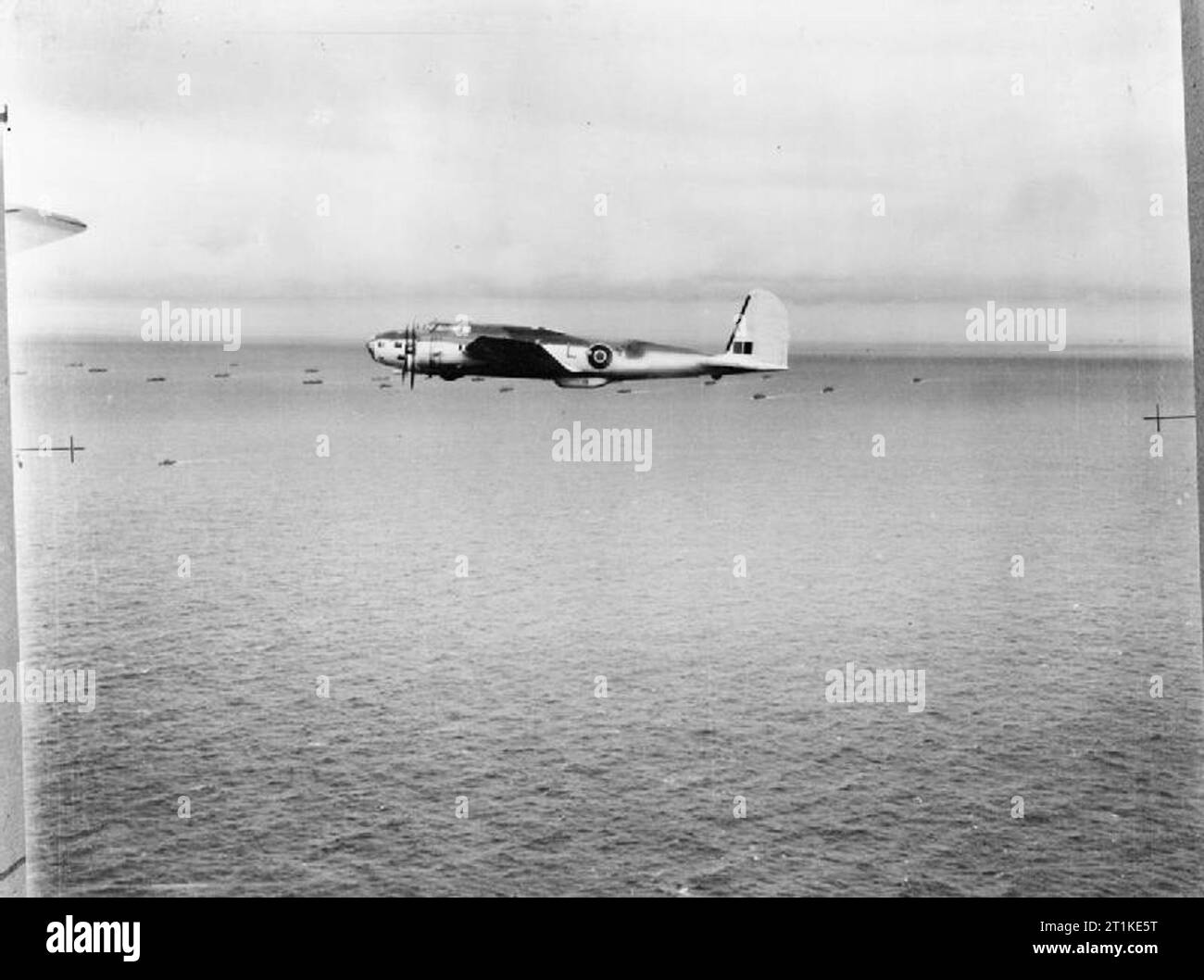 American Aircraft in Royal Air Force Service 1939-1945- Boeing Model 299 Fortress. Fortress Mark I, AN537 ?NR-L?, of No. 220 Squadron RAF based at Ballykelly, County Londonderry, on patrol over a convoy. The aircraft radar aerials, serial number and unit code letters have been obliterated by the wartime censor. Stock Photo