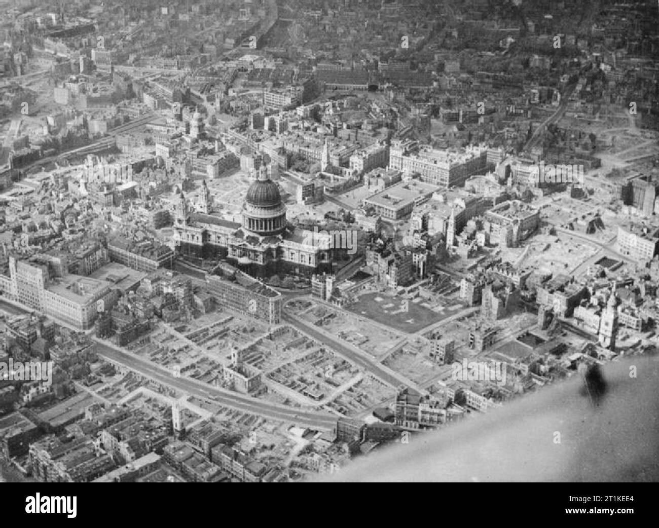 Bomb Damage in London, England, April 1945 Aerial view of the City of London around St Paul's Cathedral from the south-east in which the extent of bomb damage is clearly visible. Stock Photo
