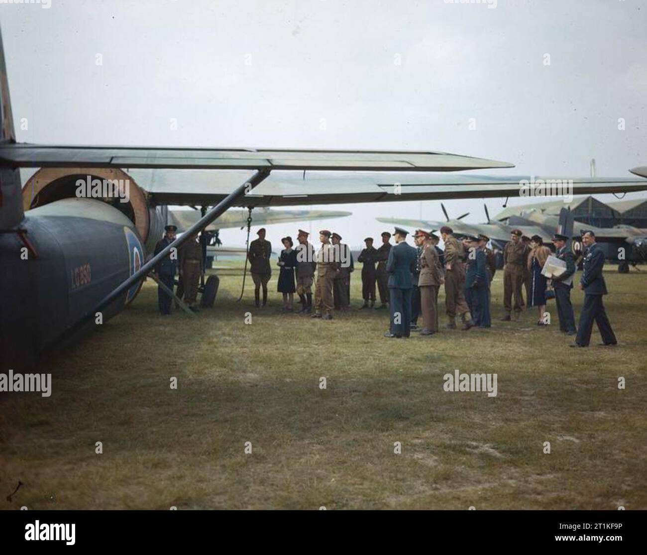Hm King George Vi and Hrh Princess Elizabeth Visit An Airborne Troops Exercise at Netheravon, 19 May 1944 HM King George VI and Princess Elizabeth, accompanied by RAF and Airborne officers, inspecting the detachable fuselage of Horsa I LG850, of No 22 Heavy Glider Conversion Unit at Netheravon. Part of an A-type hangar is visible in the background. Stock Photo