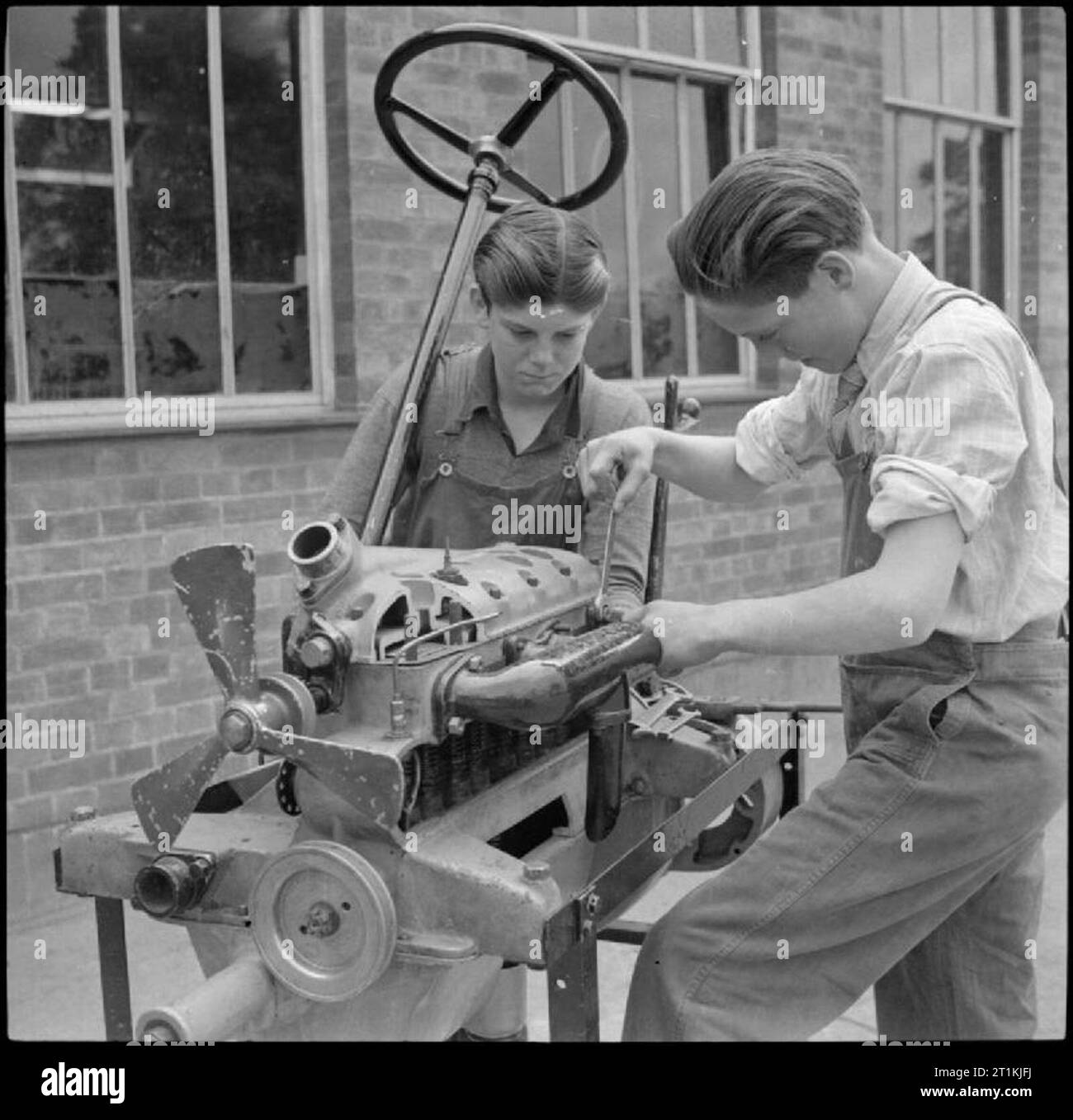 Boys driving tractor Black and White Stock Photos & Images Alamy