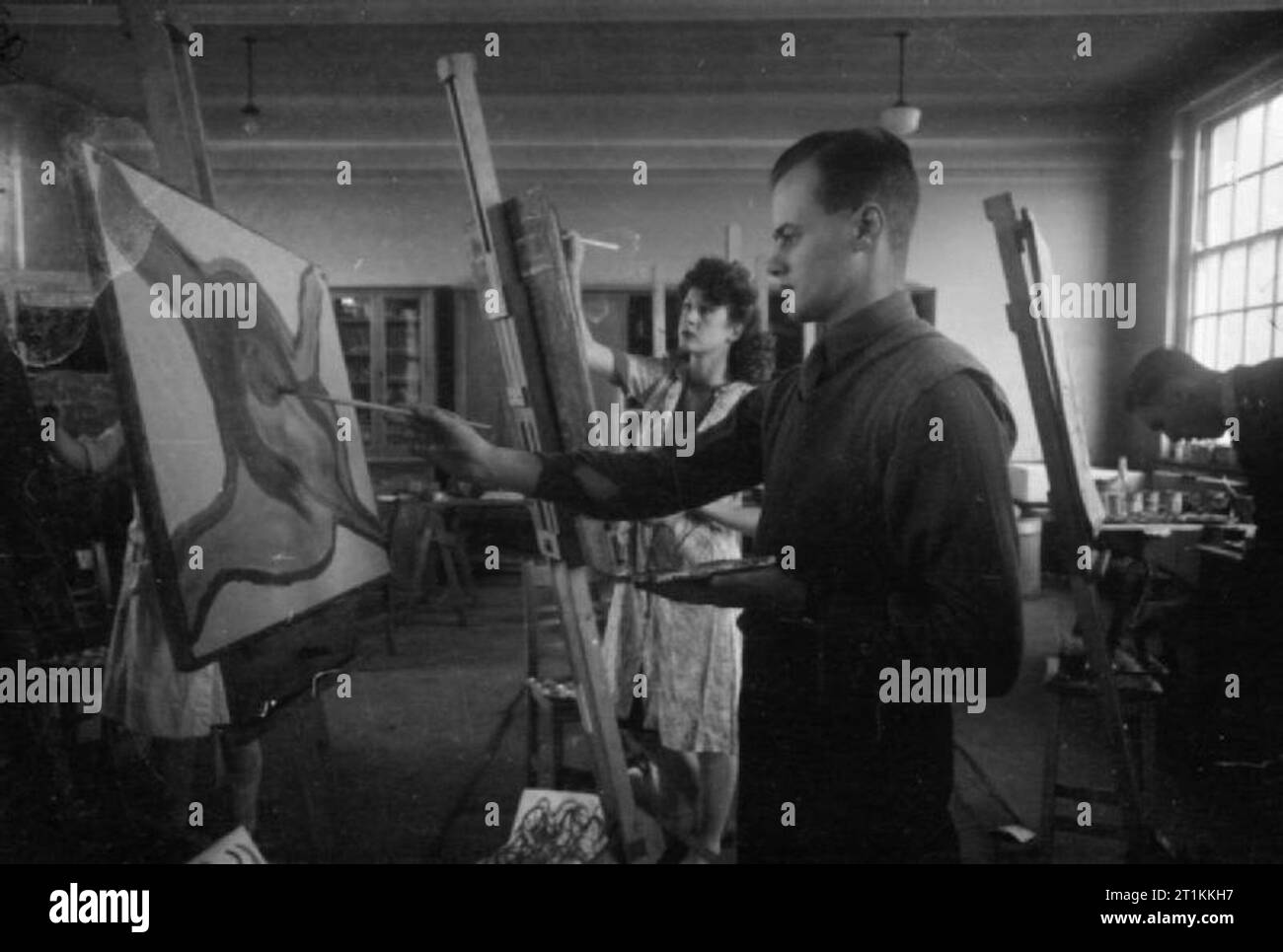 From the Services To Schoolmastering- Re-training at Goldsmith's College, London University, Nottingham, England, 1944 Two of the 28 ex-servicemen training to be teachers at Goldsmiths College (based at Nottingham University since the outbreak of war) are training to have art as their main subject. Here one of the men takes part in an art class at Nottingham University, which, according to the original caption, should give him some 'sense of design'. Stock Photo