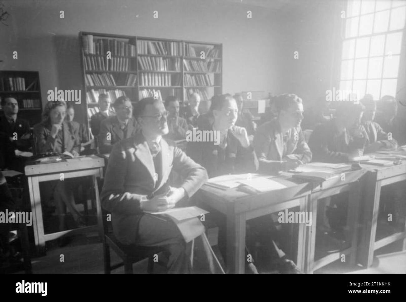 From the Services To Schoolmastering- Re-training at Goldsmith's College, London University, Nottingham, England, 1944 A class of ex-servicemen training to be teachers at Goldsmiths College (based at Nottingham University since the outbreak of war) listen to a lecture on English composition. The class is led by Dr Lewis, the Vice-Principal of Goldsmiths College (not pictured). Stock Photo