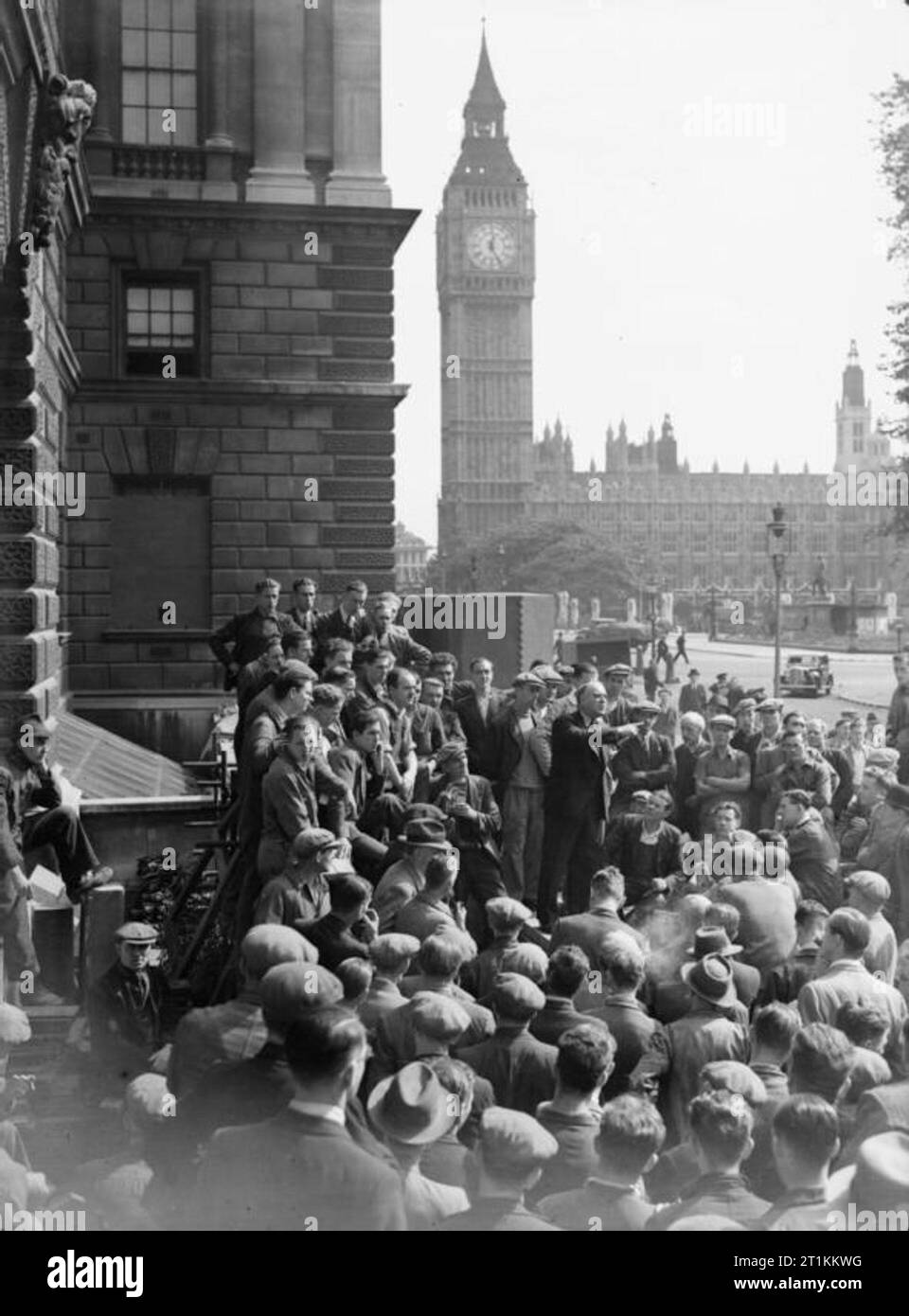 Harry Pollitt Speaks at Whitehall, London, England, 1941 Harry Pollitt, General Secretary of the Communist Party of Great Britain, gives a speech to workers in Whitehall, London, 1941. Big Ben can be clearly seen behind him. Stock Photo