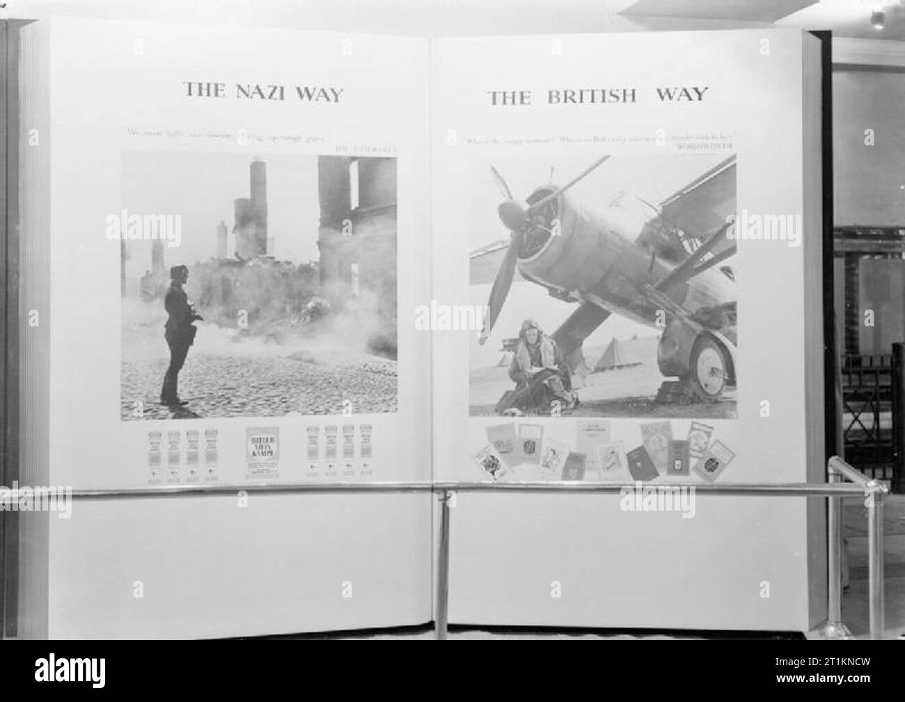 Ministry of Information Exhibitions during the Second World War, London, England, UK, 1940 A view of one of the display panels at the 'Books and Freedom' exhibition, organised by the National Book Council, at Charing Cross underground station. The display is a comparison of 'The Nazi Way' (a photograph of a German soldier amidst destruction, below which is a row of copies of 'Mein Kampf') and 'The British Way' (an airman reading beside his aircraft, below which is a selection of various different 'classic' books). Stock Photo