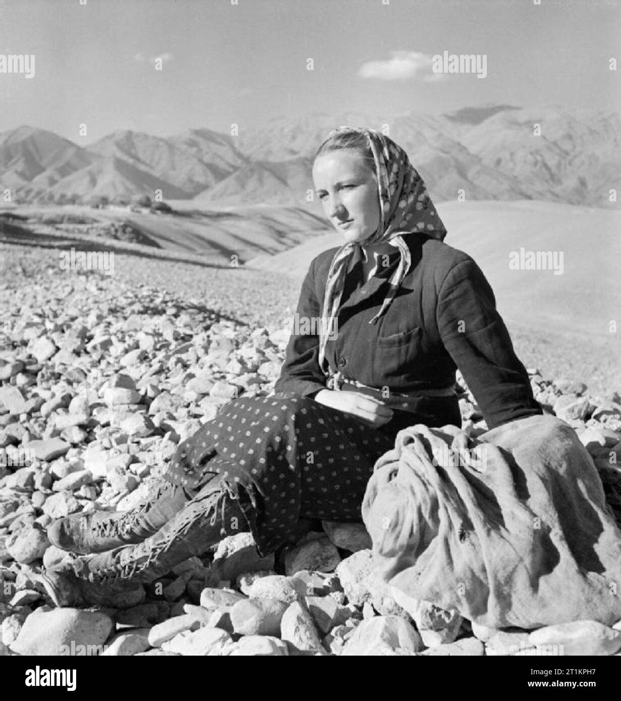 Evacuation of Polish Civilians From the Soviet Union To Persia, 1942 Grown up daughter of the Kowalski family resting during the journey on foot from the Soviet Union over the mountains into Persia. Stock Photo