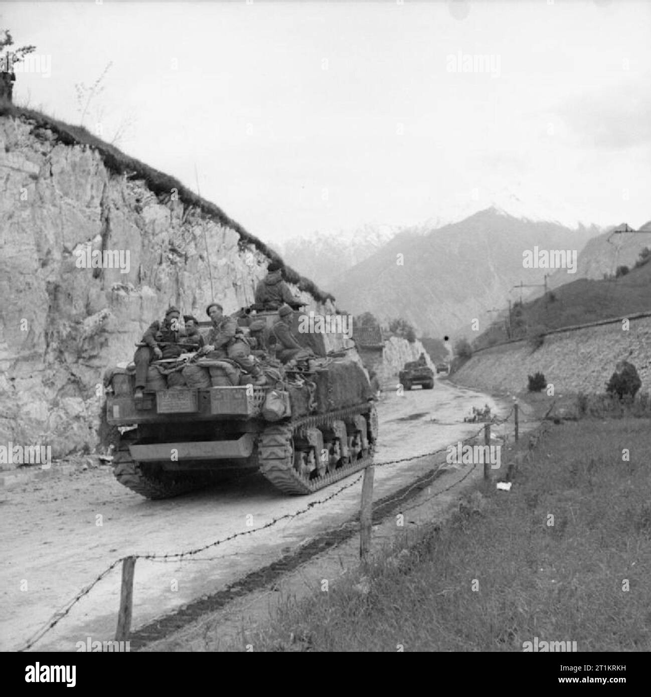 The British Army in Italy 1945 Infantry ride on Sherman tanks of 6th Armoured Division as they head towards the Austrian border, 4 May 1945. Stock Photo