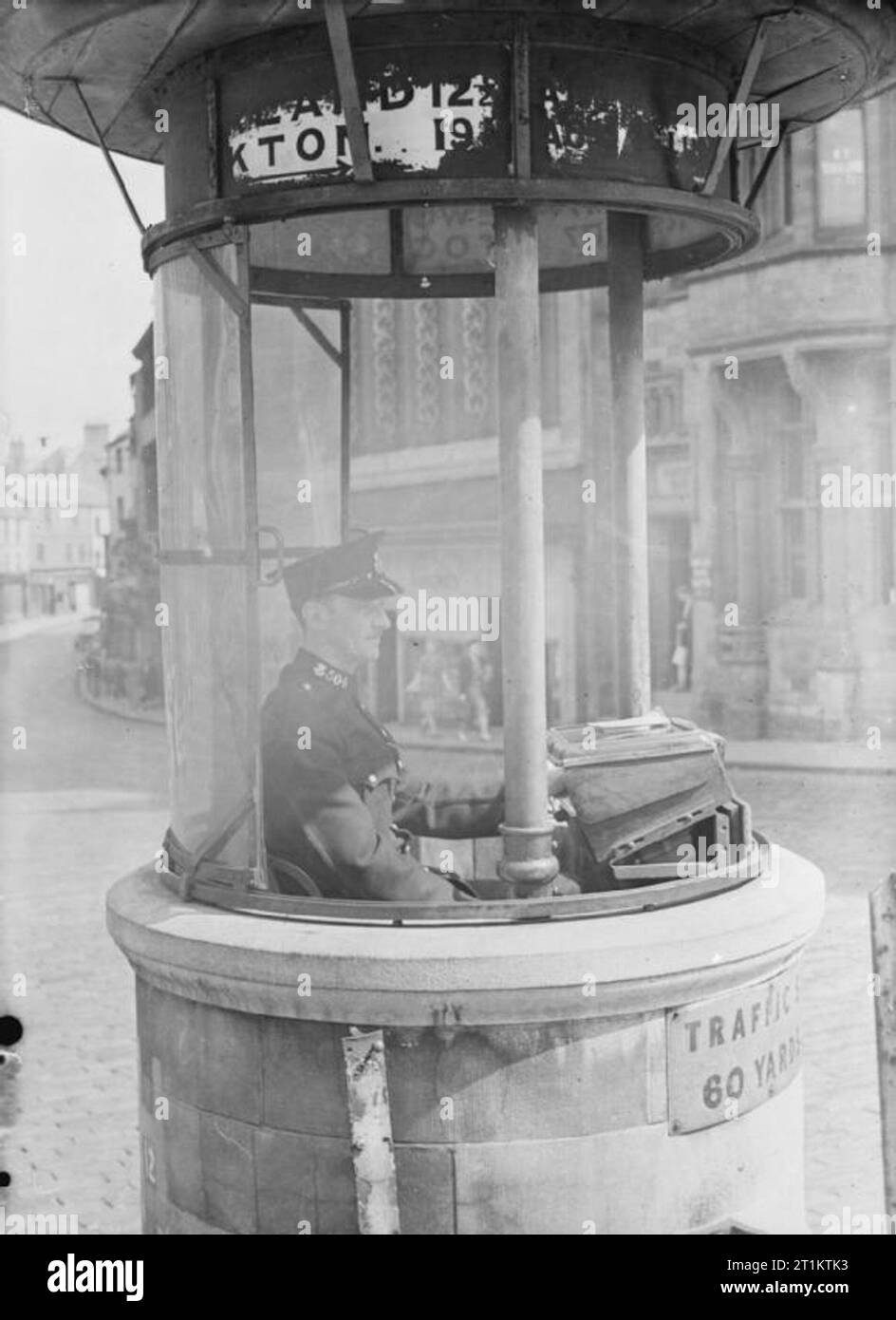 Traffic Control in Durham, England, 1943 A traffic policeman sits in
