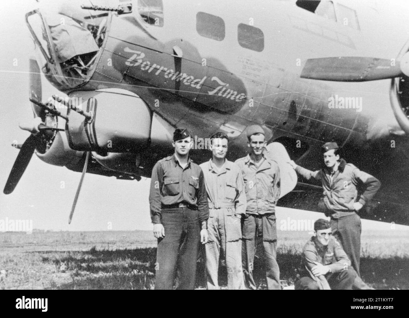 Airmen of the 452nd Bomb Group with their B-17 Flying Fortress (serial number 42-192622) nicknamed 'Borrowed Time'. Stock Photo