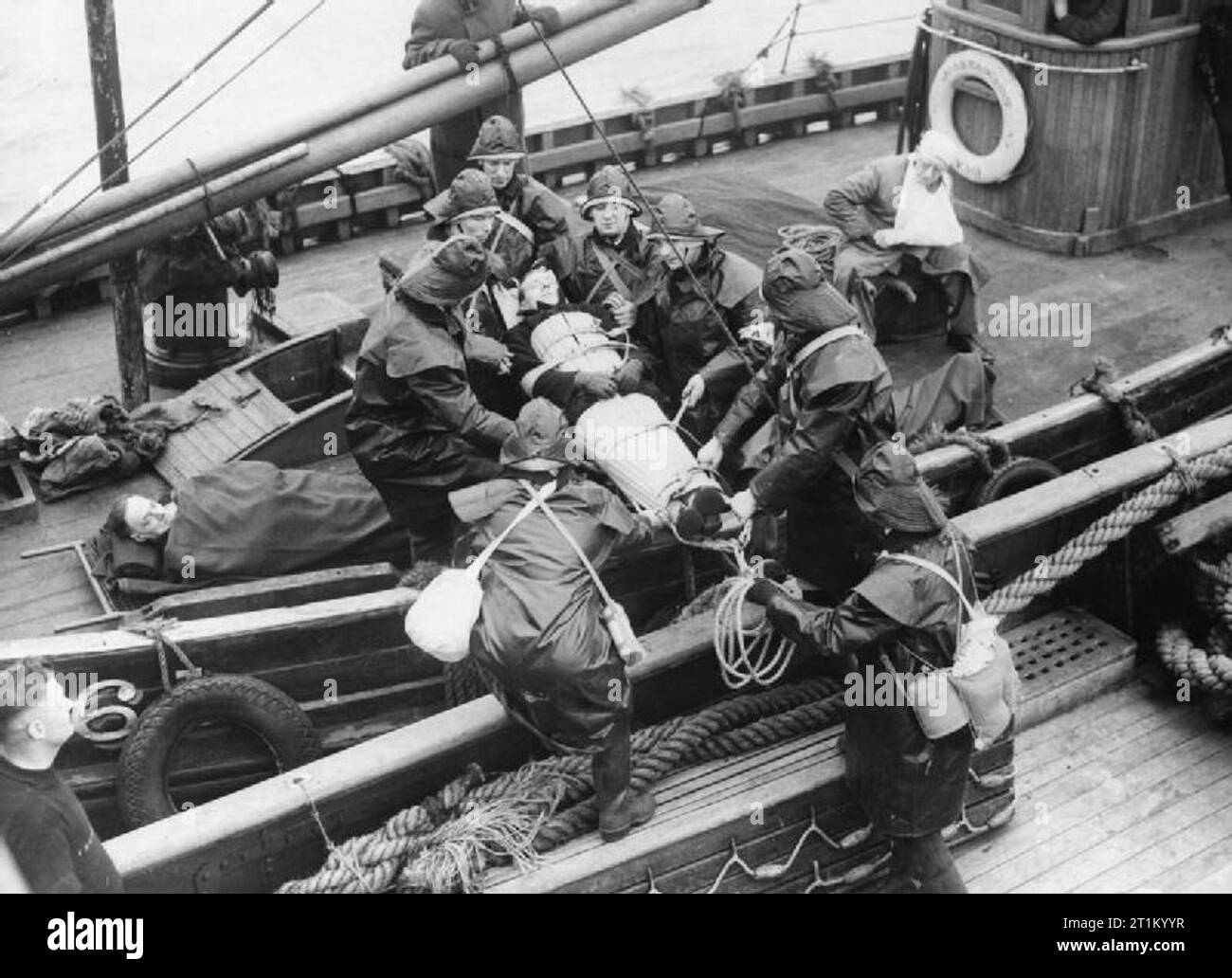 Air Raid Precautions, 1940 Air Raid Precautions (ARP) Marines based at Grimsby, move a stretcher case 'casualty' between vessels during a training exercise in assisting 'victims' of air raids off the coast of Britain, 23 February 1940. Stock Photo