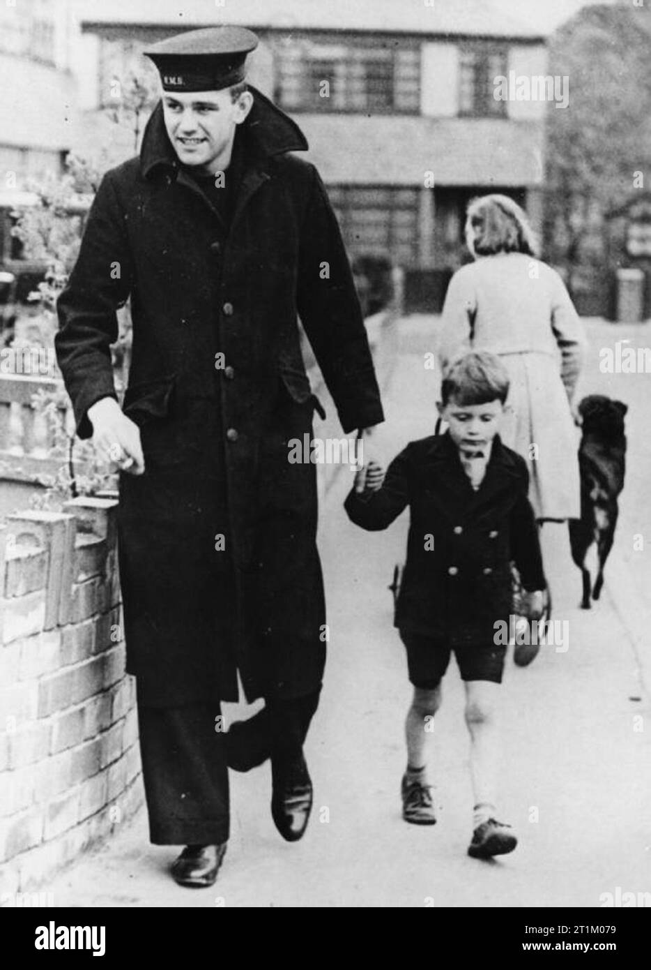 HMS Hood Seaman R Tilburn of Roundhay, Leeds, one of the three survivors of HMS HOOD out for a walk with his young brother, June 1941. Stock Photo
