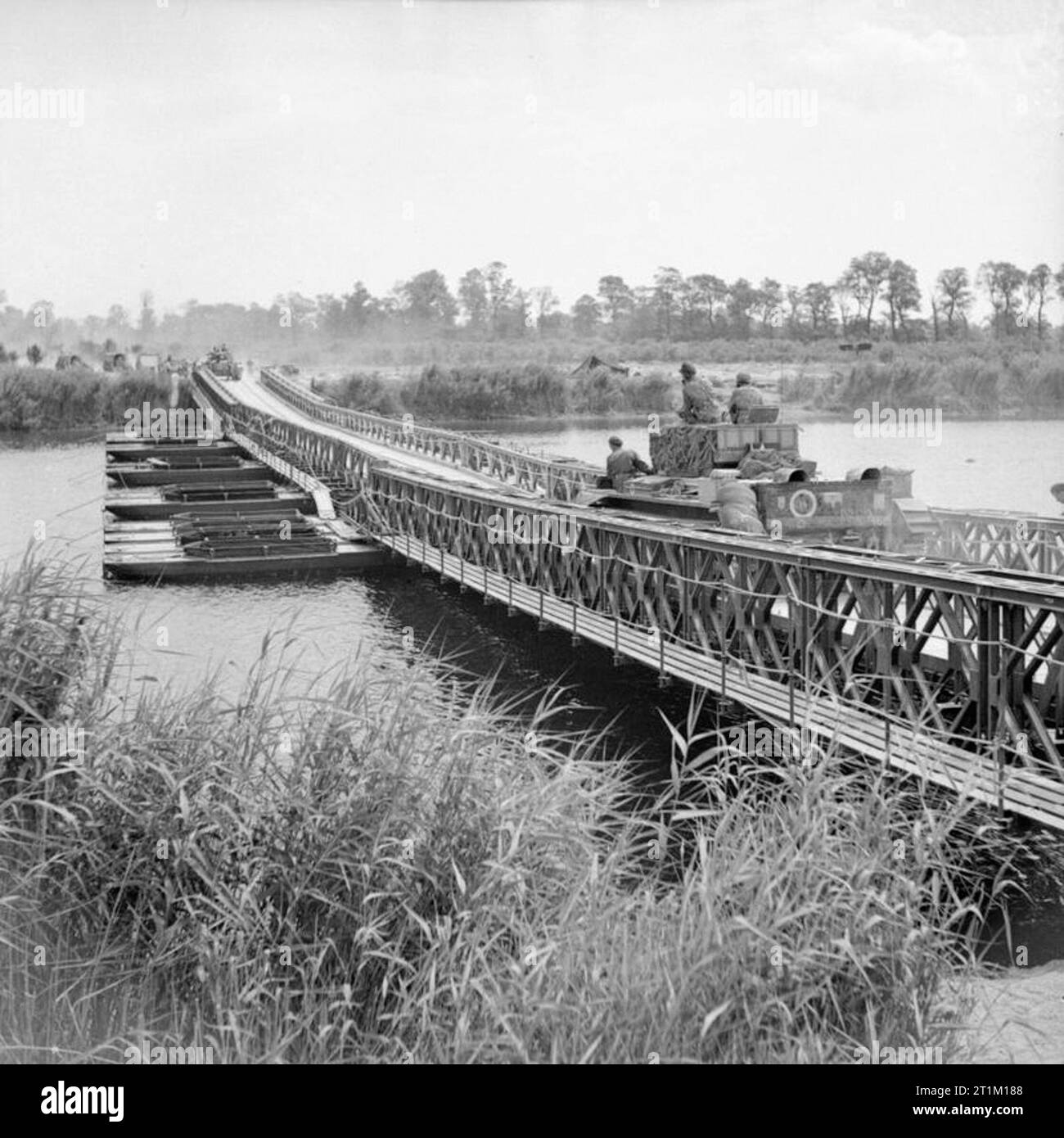 The British Army in Normandy 1944 Cromwell tanks moving across 'York' bridge, a Bailey bridge over the Caen canal and the Orne river, during Operation 'Goodwood', 18 July 1944. Stock Photo