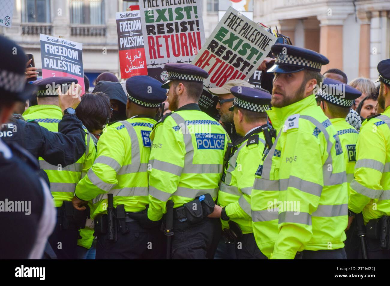 London, UK. 14th October 2023. Police form a cordon after a scuffle ...