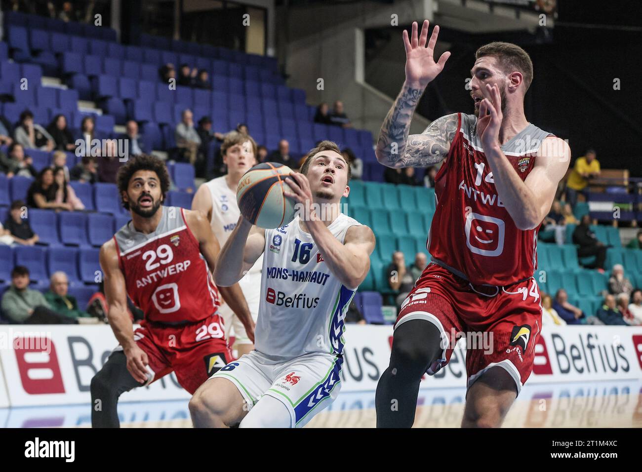 Mons, Belgium. 14th Oct, 2023. Antwerp's JeanMarc Mwema, Mons' Conley