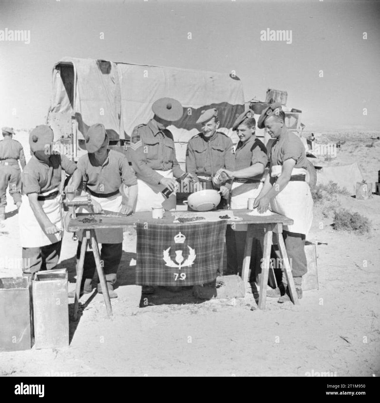The British Army in North Africa 1942 The Regimental Sergeant Major and other members of the 5th Cameron Highlanders preparing Christmas puddings in the Western Desert, 28 December 1942. Stock Photo