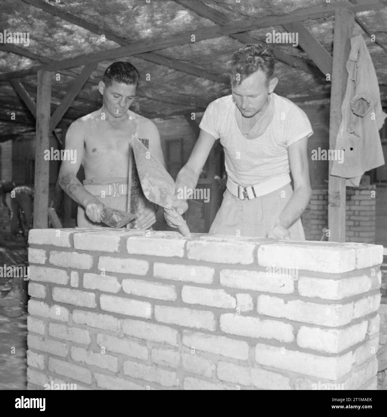 British Forces in the Middle East, 1945-1947 Trooper R Baker (left) and Bombardier J H Towns, who were both in the building trade before the war, take a refresher course in bricklaying, one of the pre-vocational courses on offer at the Middle East Base Depot of the Royal Artillery near Cairo to prepare soldiers awaiting demobilisation for a return to 'civvy street'. Stock Photo
