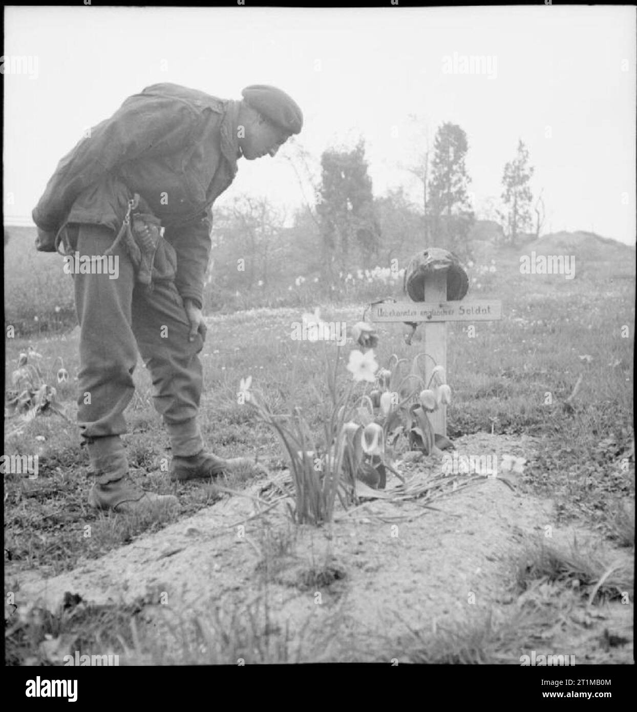 The British Army in Northwest Europe 194445 A soldier examines the grave of a 1st Airborne
