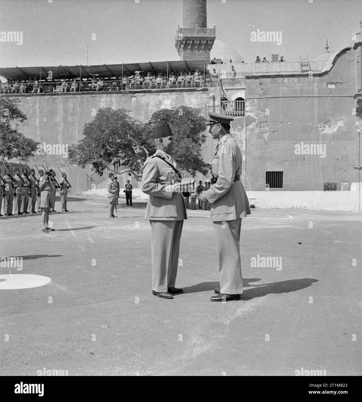 British Forces in the Middle East, 1945-1947 Lieutenant General Sir Charles Allfrey hands the key of the Citadel to the Egyptian Chief of Staff, Ferick Ibrahim Attallah Pasha, marking the formal handover of the fortress to local control. This ceremony was the first step towards the ending of British rule in Egypt. Stock Photo
