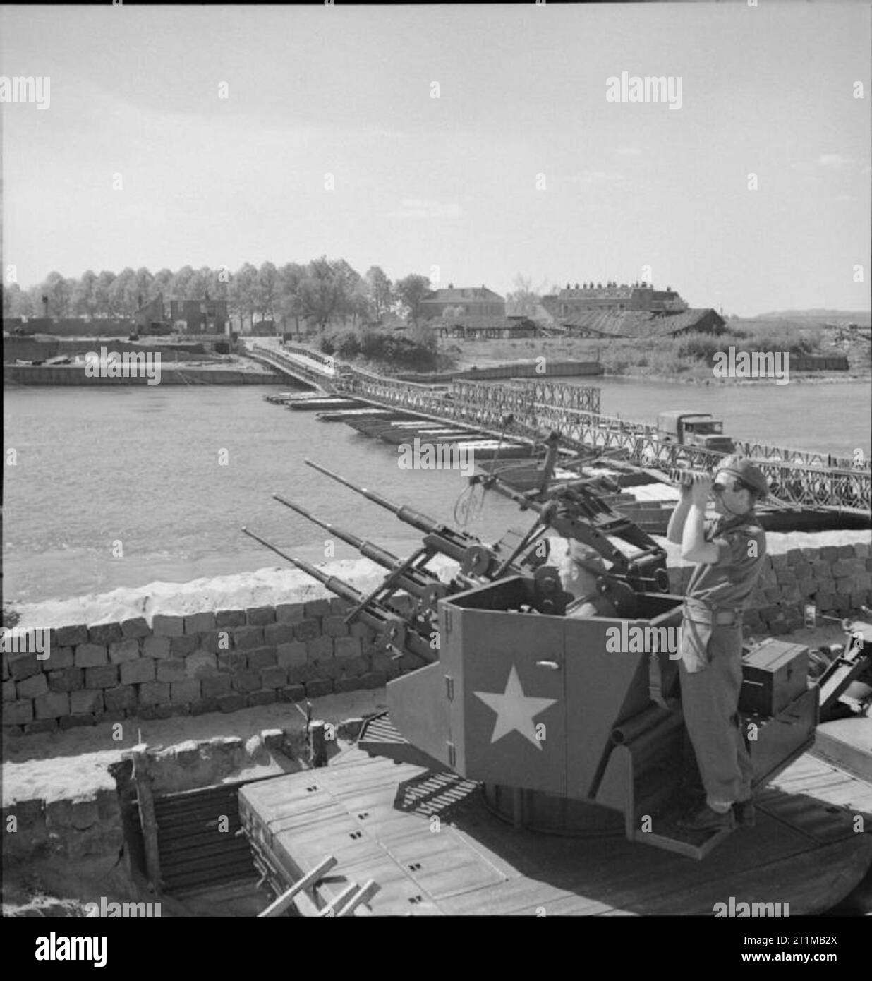 The British Army in North-west Europe 1944-45 A British triple 20mm anti-aircraft gun position guards the Bailey Bridge at Arnhem, 18 April 1945. Stock Photo