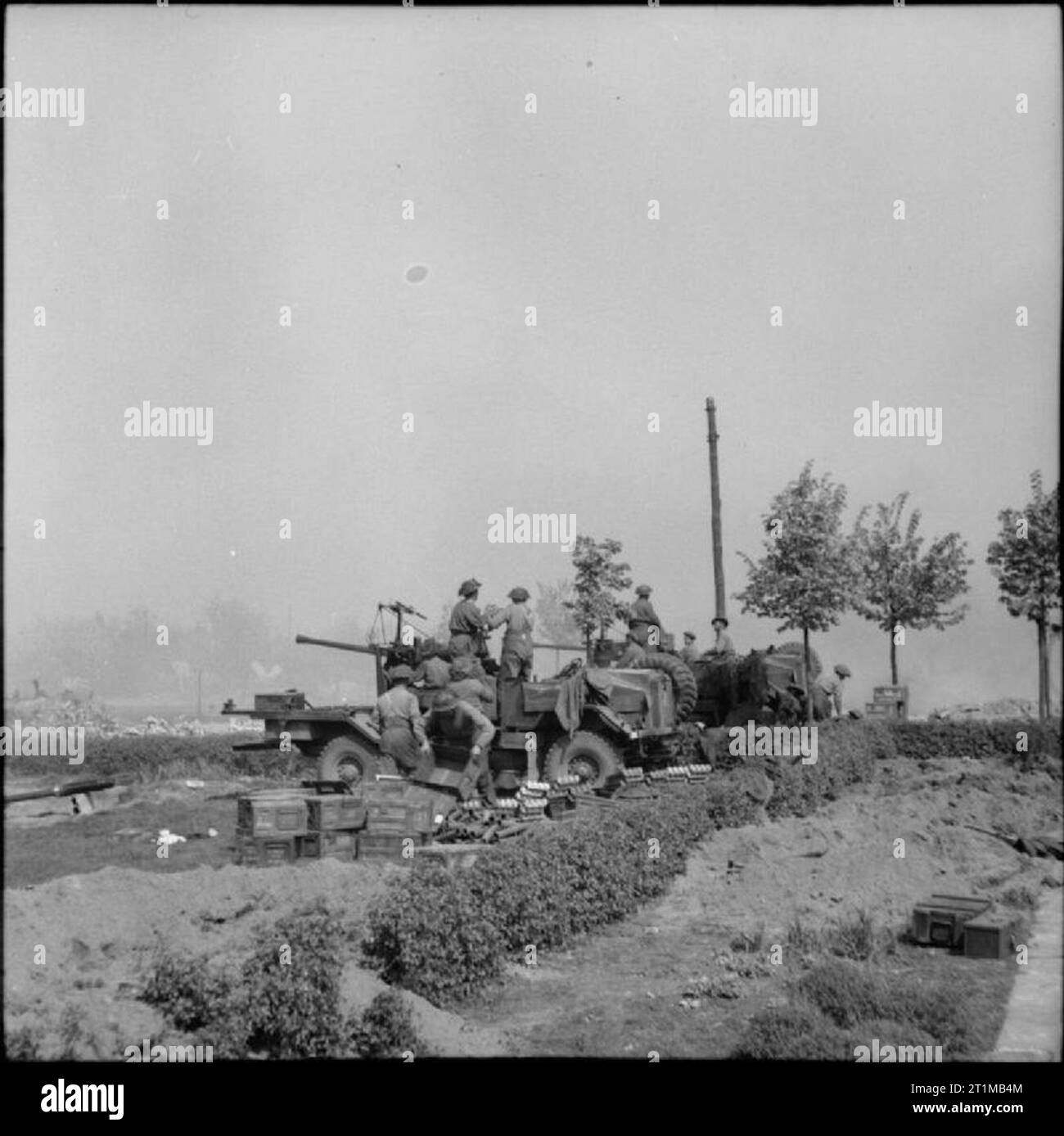 The British Army in North-west Europe 1944-45 Lorry-mounted 40mm Bofors anti-aircraft guns in action against German positions in Bremen. Stock Photo